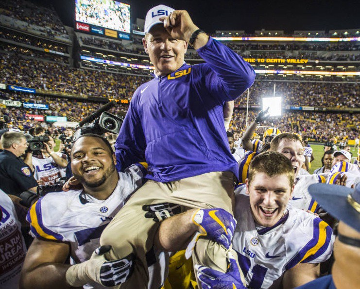 LSU head coach Les Miles is carried off the field by Vadal Alexander and Christian La Couture following the Tigers 19-7 victory over Texas A&M Saturday night