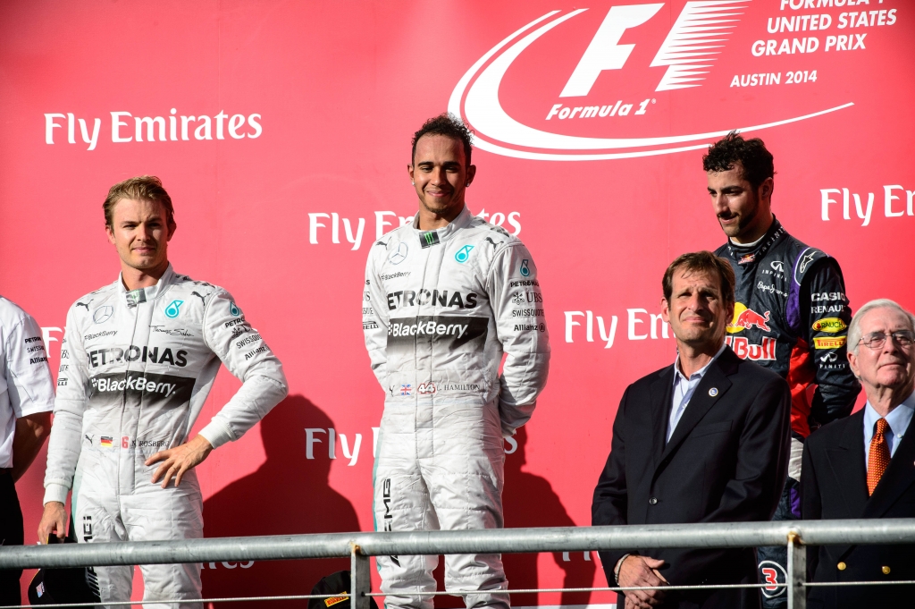 Nov 2 2014 Austin TX USA Mercedes driver Lewis Hamilton of Great Britain Mercedes driver Nico Rosberg of Germany and Red Bull Racing driver Daniel Ricciardo of Australia take the podium after the 2014 U.S. Grand Prix at Circuit of the