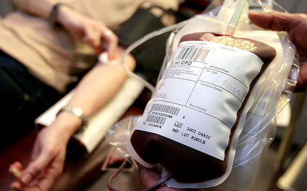 DONER GIVES BLOOD AT A NATIONAL BLOOD SERVICE CENTER IN LONDON