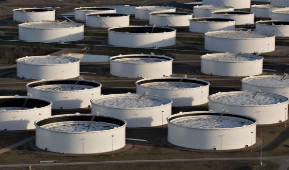 Oil-storage tanks could reach their capacity pushing prices down to levels necessary to force an immediate halt to some production Goldman Sachs said in a report Thursday