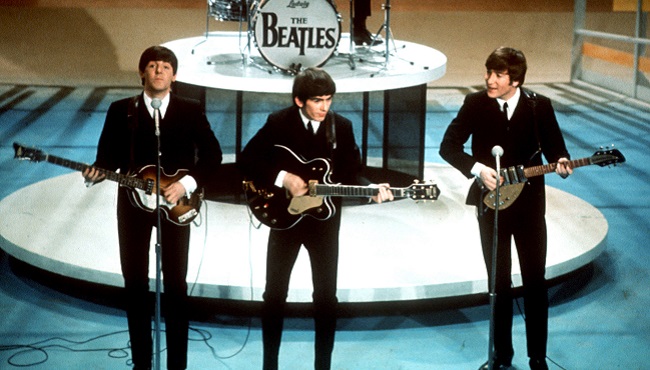 The Beatles perform on the CBS'Ed Sullivan Show in New York. They love us yeah! yeah! yeah! At 12:01 a.m. local time on Dec. 24 2015 around the world the Beatles&#039 music will be available for streaming fro