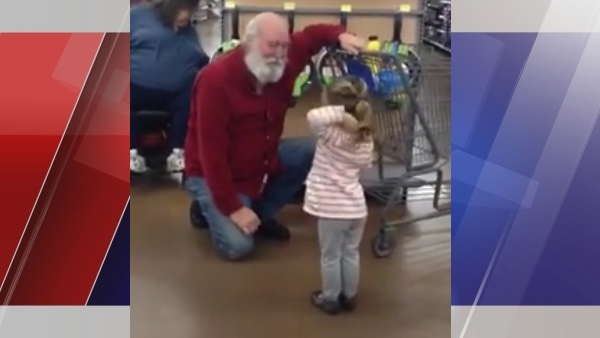 One little girl had a chance encounter with a jolly man with a white beard and red shirt and it was all caught on camera