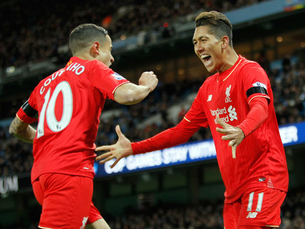 Philippe Coutinho and Roberto Firmino celebrate another goal