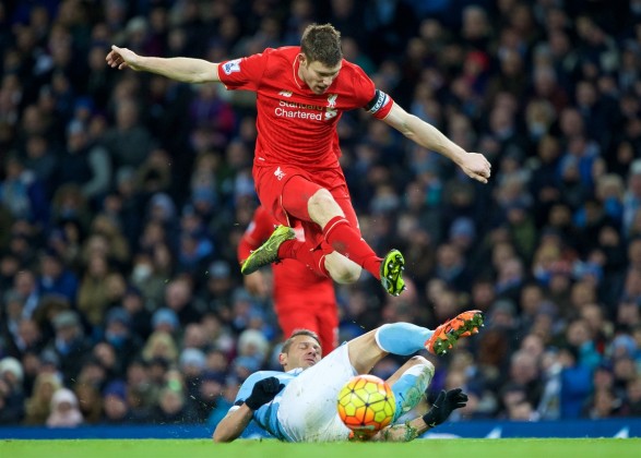 Liverpool's James Milner in action against Manchester City's Martin Demichelis during the Premier League match at the City of Manchester Stadium