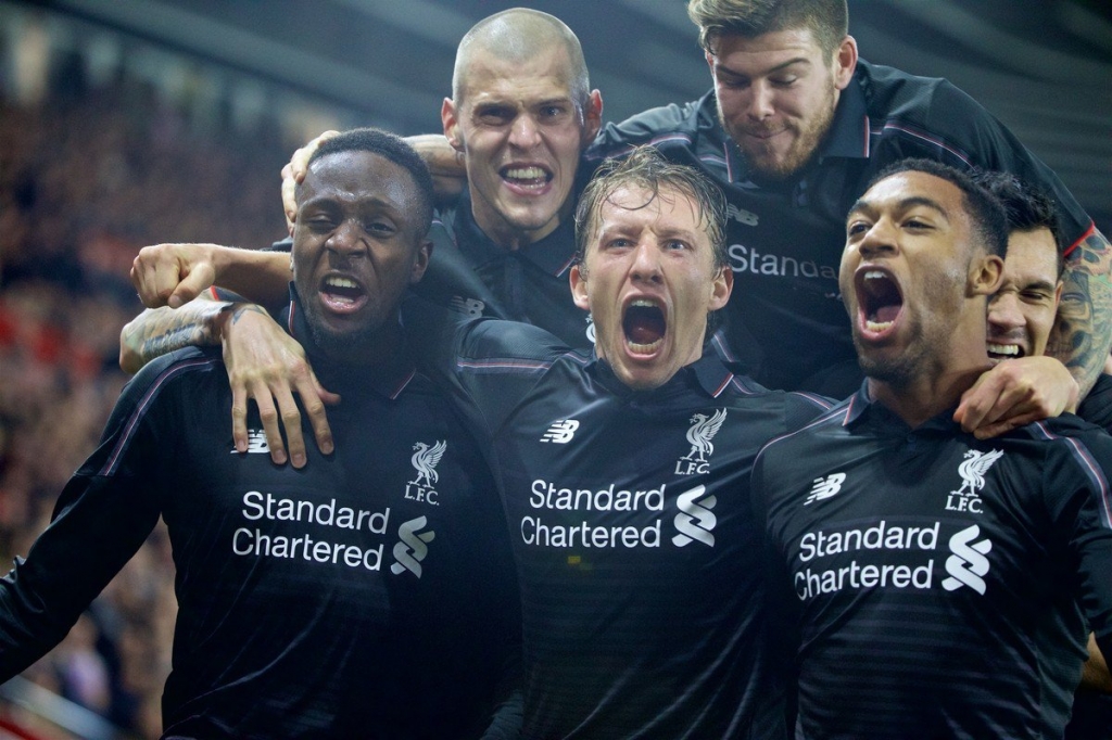 Liverpool's Divock Origi celebrates scoring the fourth goal against Southampton with team-mates Martin Skrtel Lucas Leiva Jordon Ibe Alberto Moreno and Dejan Lovren during the Football League Cup