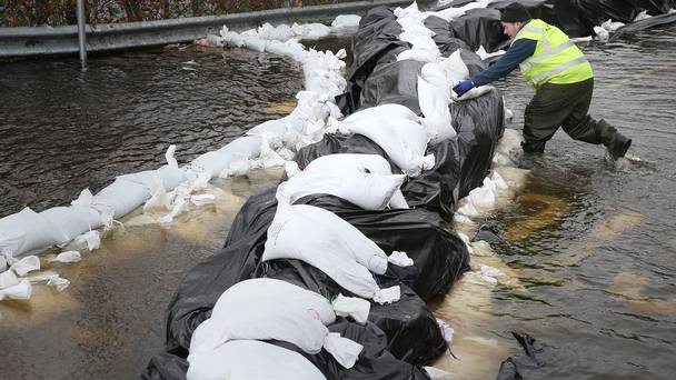 Local Councillor Kevin Moran helps with flood defences in the town Athlone by the river Shannon