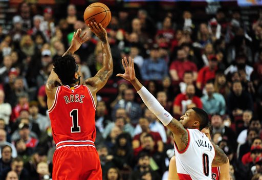 Chicago Bulls guard Derrick Rose shoots the ball on Portland Trail Blazers guard Damian Lillard during the first quarter of an NBA basketball game in Portland Ore. Tuesday Nov 24 2015