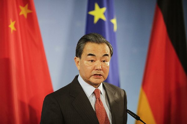 MARKUS SCHREIBER						Credit AP				Wang Yi China’s foreign minister speaks at a news conference Saturday during a visit to Berlin