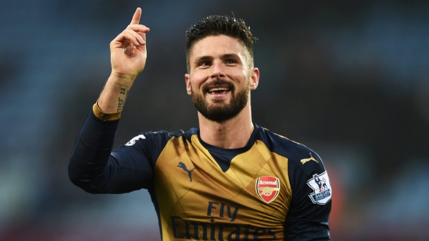 Arsenal striker Olivier Giroud celebrates his team's 2-0 win over Aston Villa that sent them top of the league