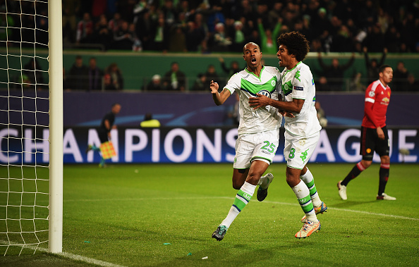 WOLFSBURG GERMANY- DECEMBER 08 Naldo of Wolfsburg celebrates scoring the first goal with Dante during the UEFA Champions League match between VfL Wolfsburg and Manchester United FC at the Volkswagen arena