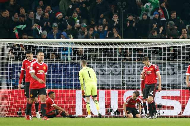 Manchester United players look dejected after Naldo scored the third goal for Wolfsburg. Reuters