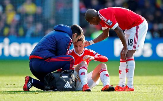 Manchester United's Ander Herrera receives treatment before going off injured