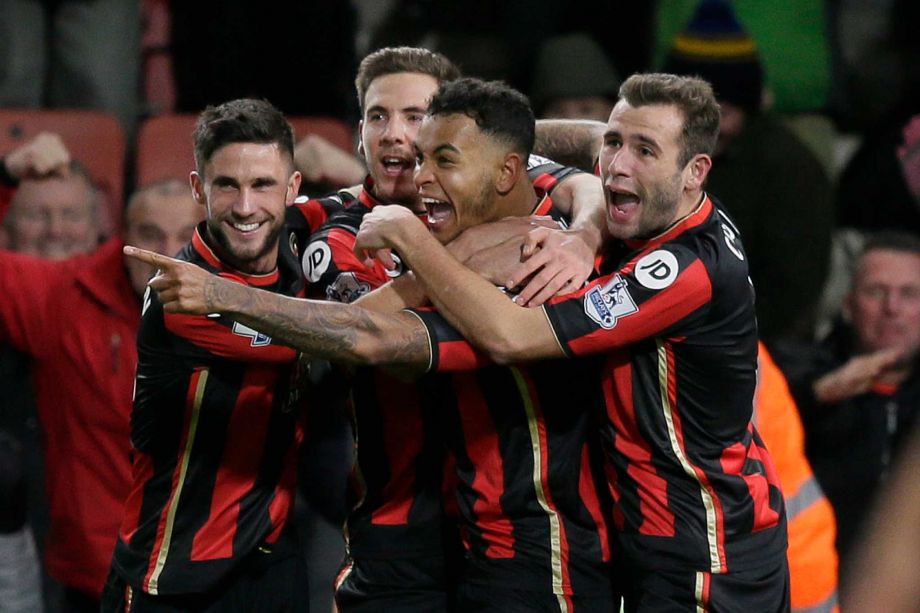 Bournemouth’s Joshua King centre celebrates after scoring a goal during the English Premier League soccer match between Bournemouth and Manchester United at the Vitality Stadium in Bournemouth England Saturday Dec. 12 2015