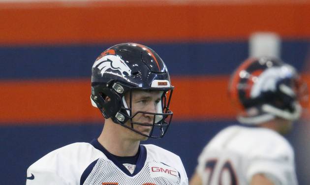 Denver Broncos quarterback Peyton Manning warms up during a practice at the team's headquarters Wednesday Dec.16 2015 in Englewood Colo