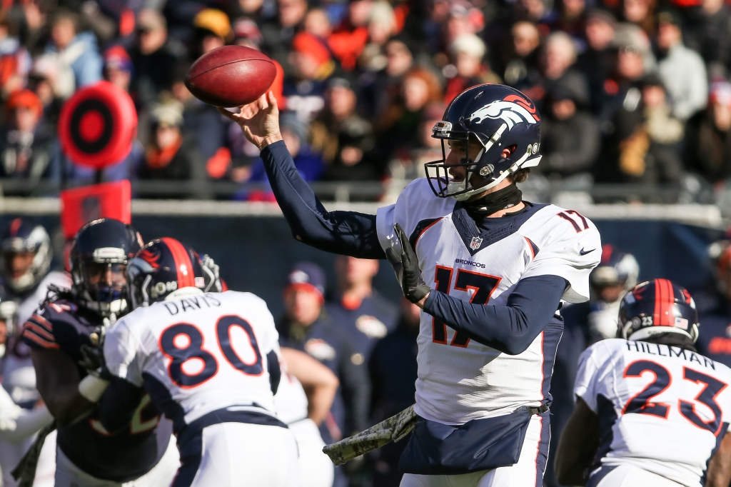 Quarterback Brock Osweiler #17 of the Denver Broncos throws a pass in the first quarter against the Chicago Bears at Soldier Field