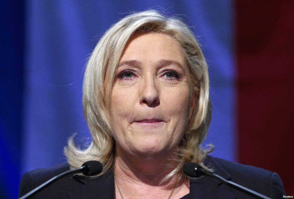 France- Marine Le Pen French National Front political party leader and candidate for the National Front in the Nord-Pas-de-Calais-Picardie region reacts after results in the second-round the regional elections are announced in Henin-Beaumont Fran