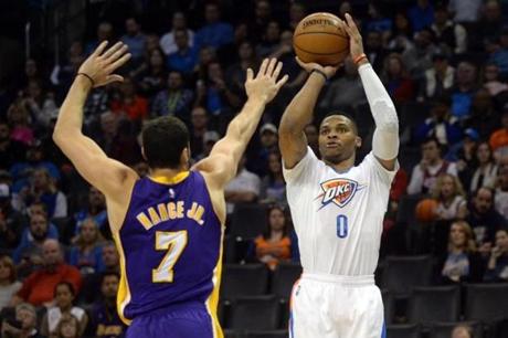 Thunder guard Russell Westbrook took a shot in the third quarter as Lakers forward Larry Nance Jr. defended