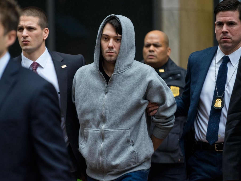 Martin Shkreli the former hedge fund manager under fire for buying a pharmaceutical company and ratcheting up the price of a life-saving drug is escorted by law enforcement agents in New York