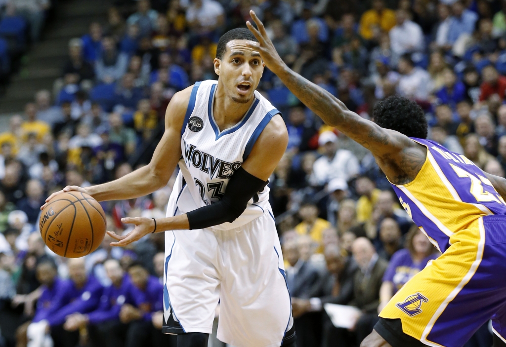 Minnesota Timberwolves guard Kevin Martin left looks to pass under pressure from Los Angeles Lakers guard Louis Williams right during the first half of an NBA basketball game in Minneapolis Wednesday Dec. 9 2015. There Timberwolves won 123-122 in