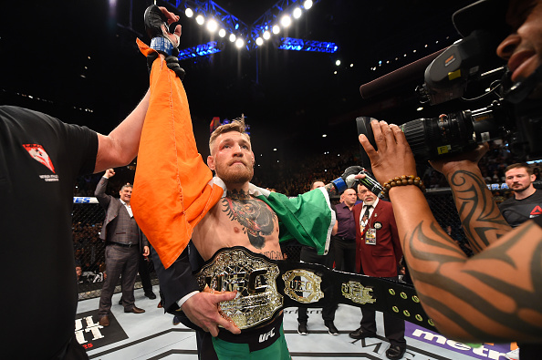 Conor Mc Gregor of Ireland reacts to his victory over Jose Aldo of Brazil in their UFC featherweight championship bout during the UFC 194 event inside MGM Grand Garden Arena