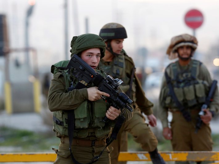 Members of the Israeli armed forces at the Howwara checkpoint Nablus West Bank 25 December 2015.. EPA  ALAA BADARNEH