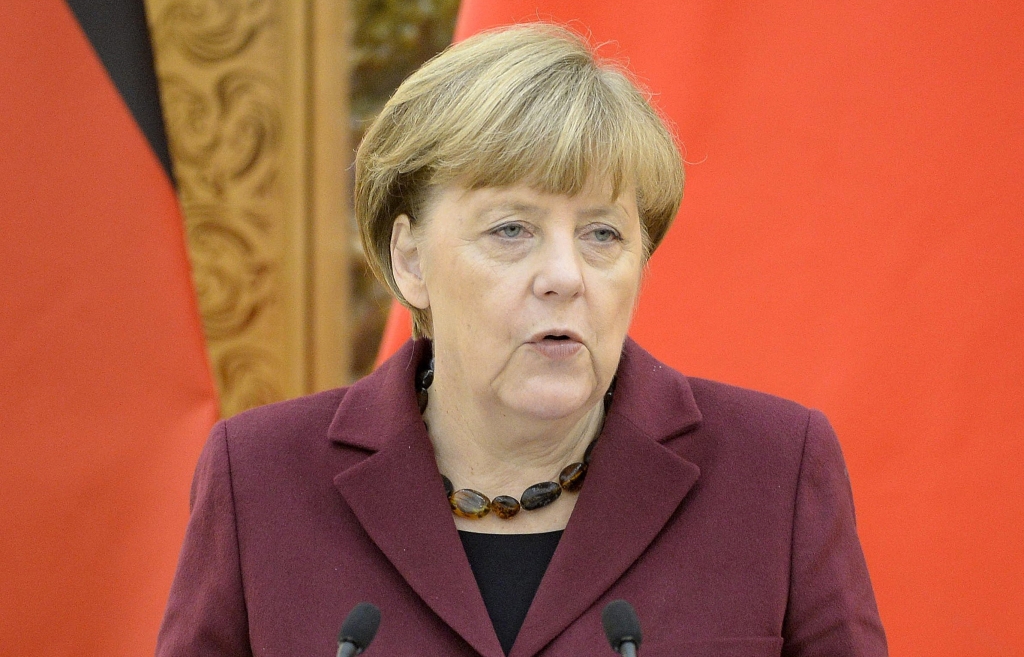 German Chancellor Angela Merkel speaks during a joint news conference with Chinese Premier Li Keqiang at the Great Hall of the People in Beijing