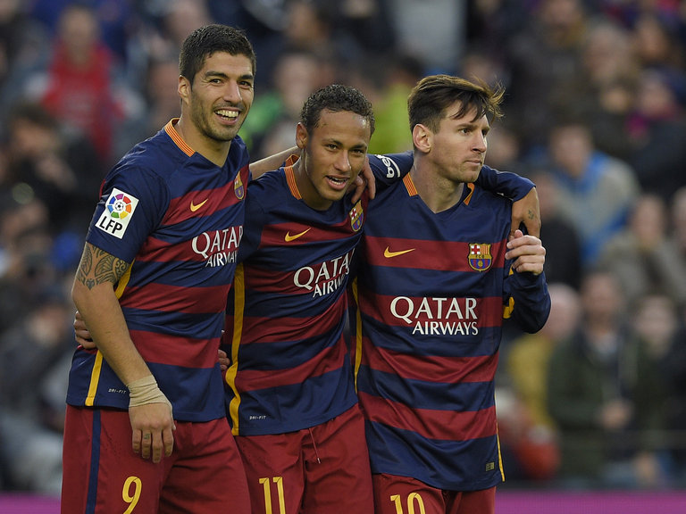 Neymar celebrates with Barcelona forward Luis Suarez and Lionel Messi