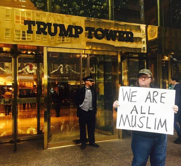 Scowling filmmaker Michael Moore had message about “angry white guys” for Donald Trump outside Trump Tower on Wednesday