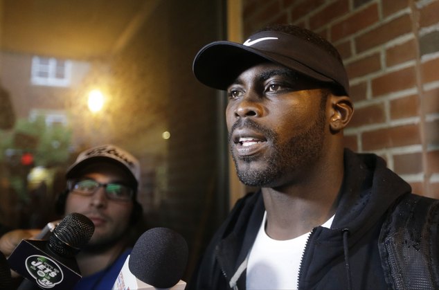 New York Jets Michael Vick responds to questions during a news interview before a session at NFL footba