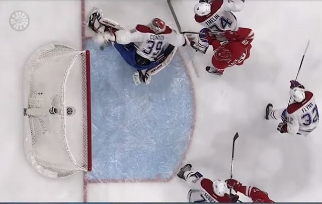 Mike Condon swats away a goal without seeing the puck