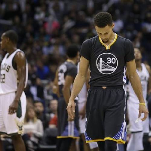 Warriors&#039 Stephen Curry looks down during the second half of an NBA basketball game against the Milwaukee Bucks Saturday Dec. 12 2015 in Milwaukee. The Bucks won 108-95