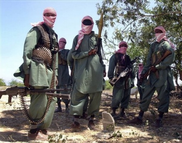 Armed al-shabab fighters on pickup trucks prepare to travel into the city just outside Mogadishu in Somalia in this file