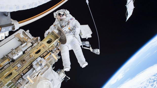 Flight Engineer Tim Kopra on a spacewalk outside the International Space Station before the delivery