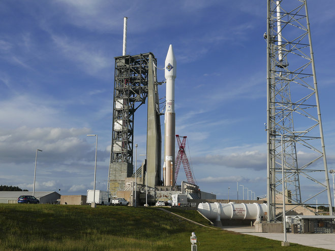 An unmanned Atlas V rocket sits on the launch pad Wednesday Dec. 2 2015 at Cape Canaveral Fla. The rocket is due to lift off early Thursday evening with 7,400 pounds of supplies for the International Space Station