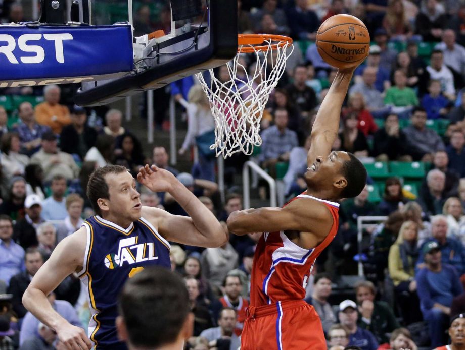 Los Angeles Clippers forward Wesley Johnson goes to the basket as Utah Jazz forward Joe Ingles waetches during the second quarter of an NBA basketball game Saturday Dec. 26 2015 in Salt Lake City