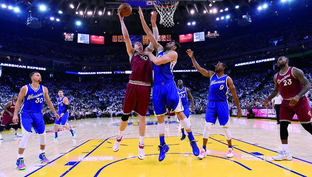 On lockdown Andrew Bogut stretches to block Timofey Mozgov