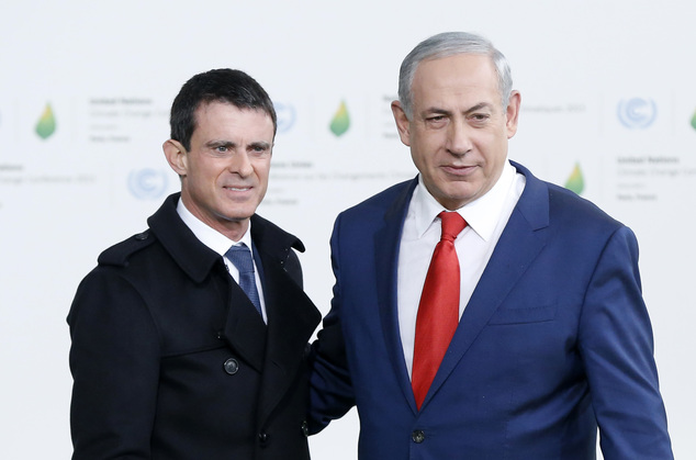 Israel's Prime Minister Benjamin Netanyahu right is greeted by French Prime Minister Manuel Valls as he arrives for the COP21 United Nations Climate Change