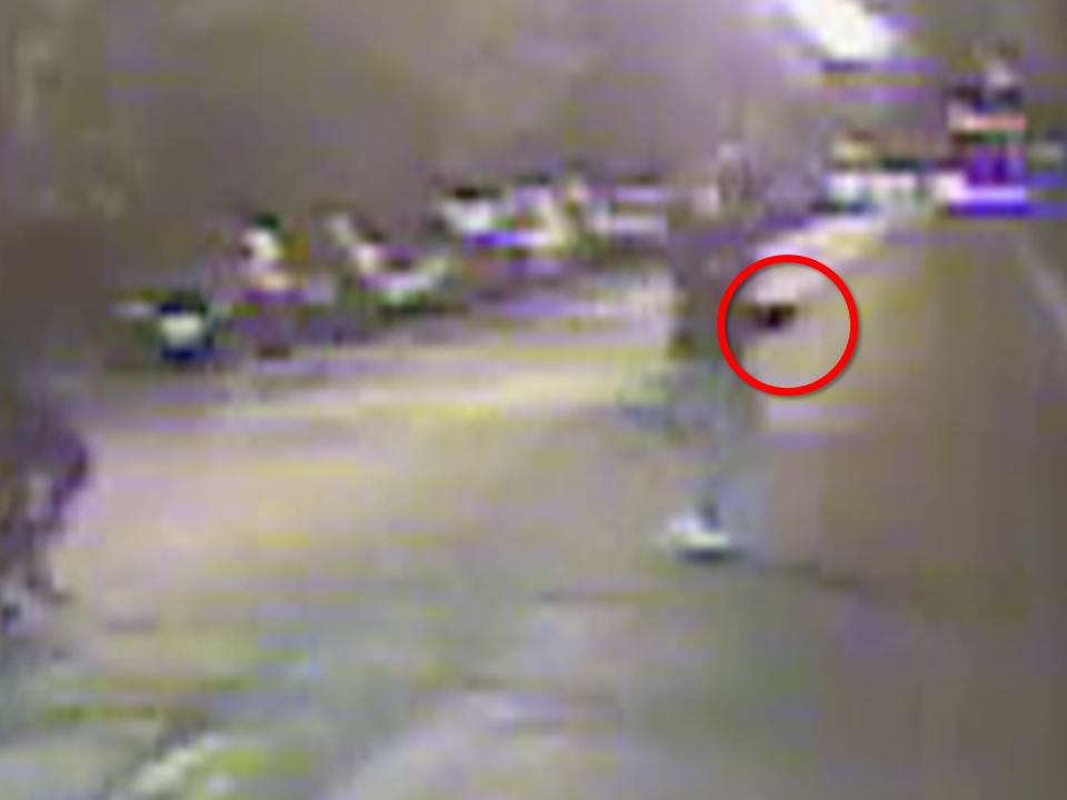 The Cook County State's Attorney says this enhanced image from a dash cam video shows Ronald Johnson carrying a gun