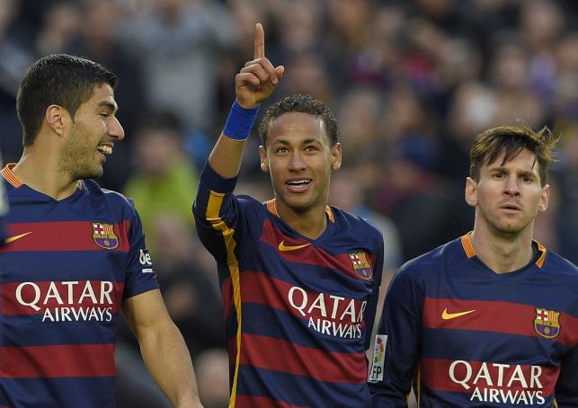 Barcelona forward Neymar celebrates with Luis Suarez and Lionel Messi after scoring their third goal during the Spanish league football match FC Barcelona vs Real Sociedad de Futbol at the Camp Nou stadium in Barcelona on Saturday. AFP