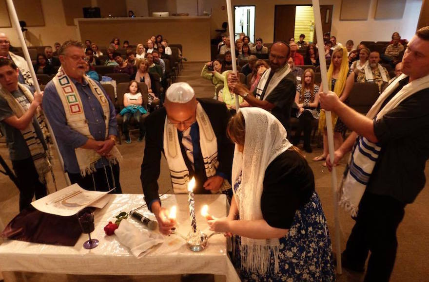 Nicholas Thalasinos renewing his marital vows with his wife at a Jewish-style ceremony 2013