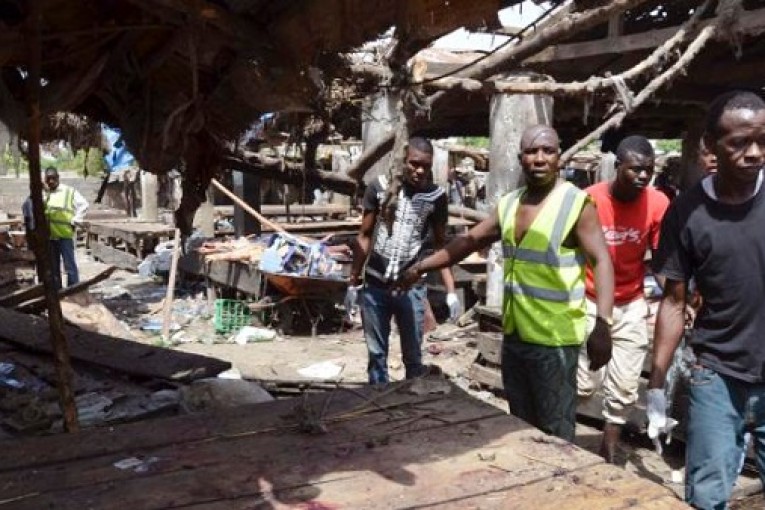 Suicide bombers kill more than 60 in wave of attacks in northeast Nigerian city