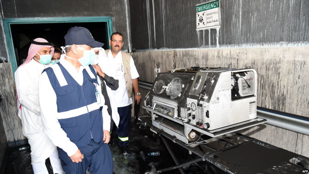 Saudi officials inspect damage inside the Jazan General Hospital after a blaze broke out in the intensive care unit and maternity department Dec. 24 2015 in Saudi Arabia's southern Jizan province