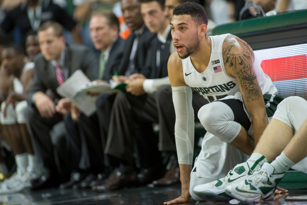 Michigan State's Deyonta Davis and Eron Harris and Florida's Ke Vaughn Allen and Devin Robinson vie for a rebound during the first half of an NCAA college basketball game Saturday Dec. 12 2015 in East Lansing Mich. (AP Phot