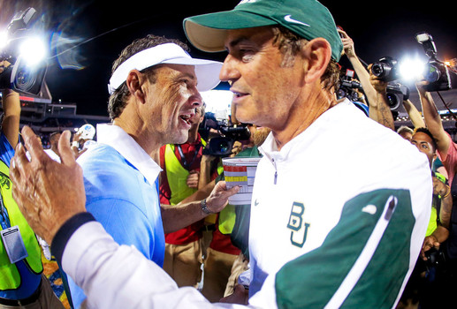 Baylor Coach Art Briles and North Carolina coach Larry Fedora meet after Russell Athletic Bowl.....Baylor won the game with new offense