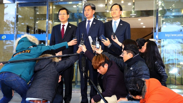 Hwang Boogi centre South Korea's vice-minister of unification and the head negotiator for high-level talks with North Korea speaks to the media before leaving for the meeting in Kaesong