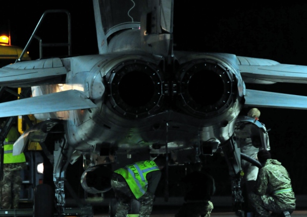 Ground crew work on a RAF Tornado GR4 after it returned to RAF Akrotiri in Cyprus as jets carried out the first British bombing runs over Syria the Ministry of Defence confirmed