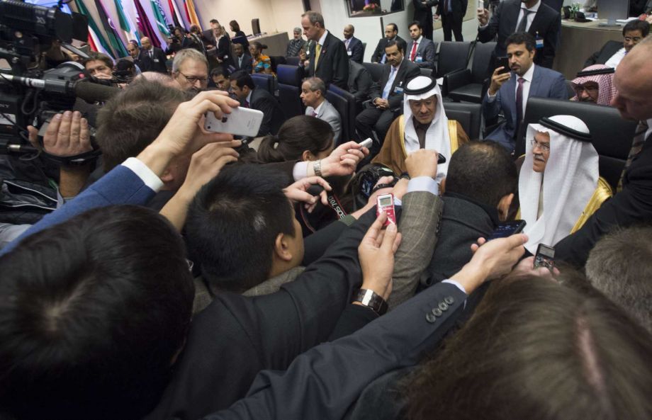 Saudi Arabia’s minister of oil and mineral resources Ali al Naimi, is surrounded by journalists as he attends Friday’s OPEC meeting in Vienna