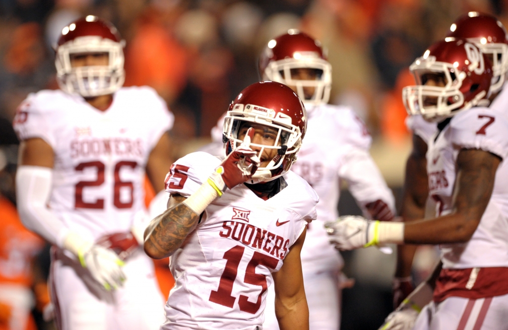 Oklahoma cornerback Zack Sanchez gestures to Oklahoma State fans in the endzone following a teammate's touchdown during an NCAA college football game in Stillwater Okla. Saturday Nov. 28 2015