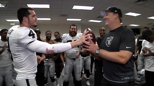 Oakland Raiders QB Derek Carr handing game ball to head coach Jack Del Rio after big win over Denver Broncos