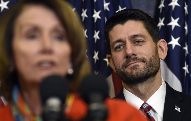 House Speaker Paul Ryan of Wis. listens as House Minority Leader Nancy Pelosi of Calif. speaks on Capitol Hill in Washington Wednesday Dec. 9 2015 before Ryan signed legislation that changes how the nation's public schools are evaluated rewriting the